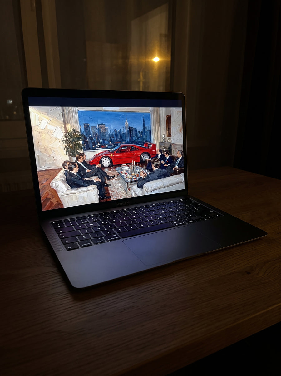 Vellum wallpaper on a MacBook Air in a dim room