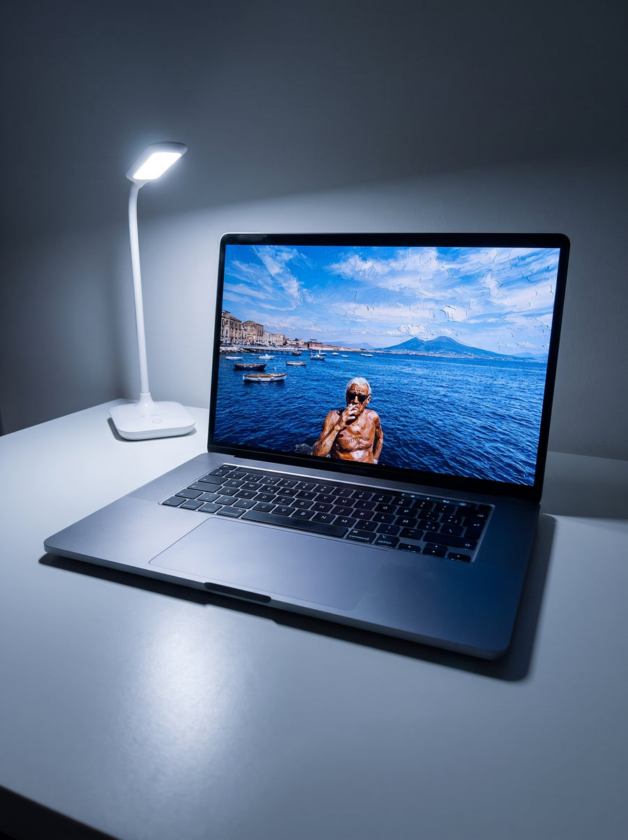 Vellum wallpaper on a MacBook Pro on a desk